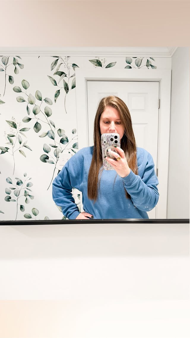 Instagram post by @courtney_sherrill_ for Photowall. Caption reads: #ad we had a bathroom refresh in the guest house....