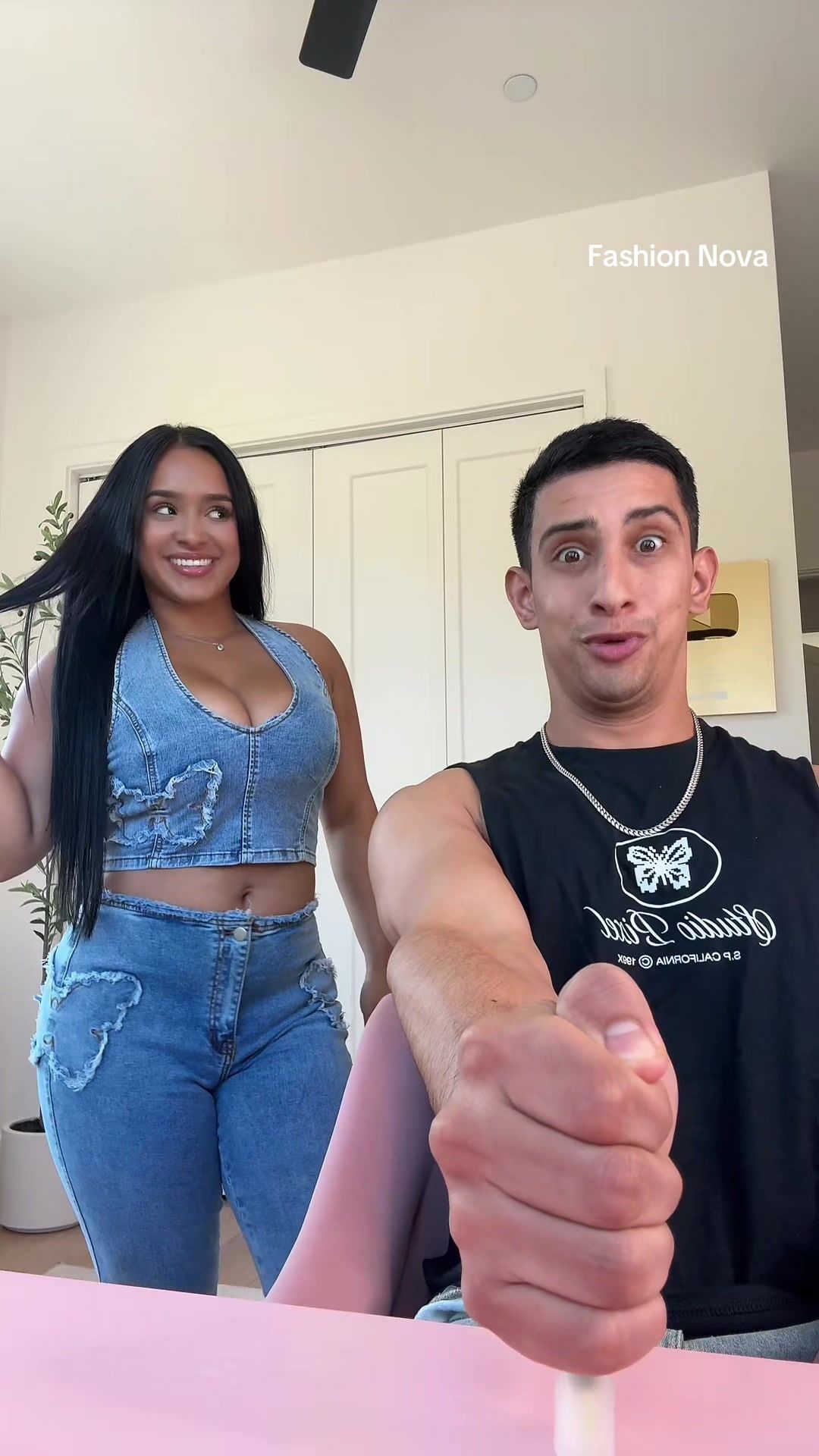 TikTok post by @isaacandandrea9 for Fashion Nova. Caption reads: Approved ✅ @Fashion Nova #fyp #FashionNova #viral....