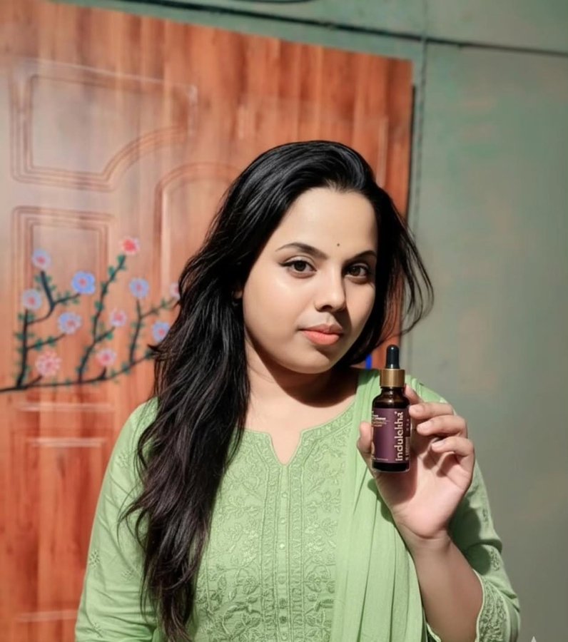 Instagram post by @theanitaroy1 for Indulekha. Caption reads: 100% Ayurvedic, chemical-free

care

With the....