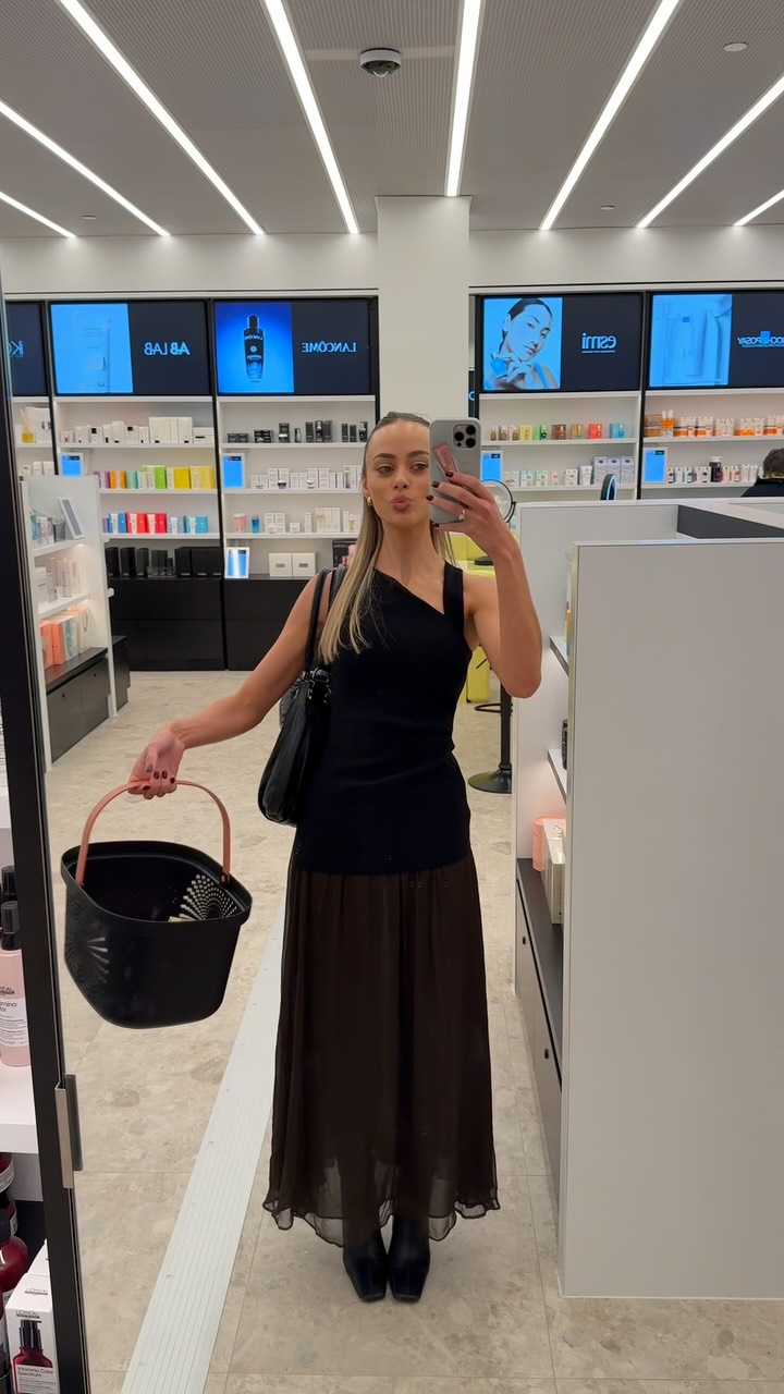 Instagram post by @emdavies___ for Adore Beauty. Caption reads: @adorebeauty has a store IRL now, guys 🥳🥳🥳 and....