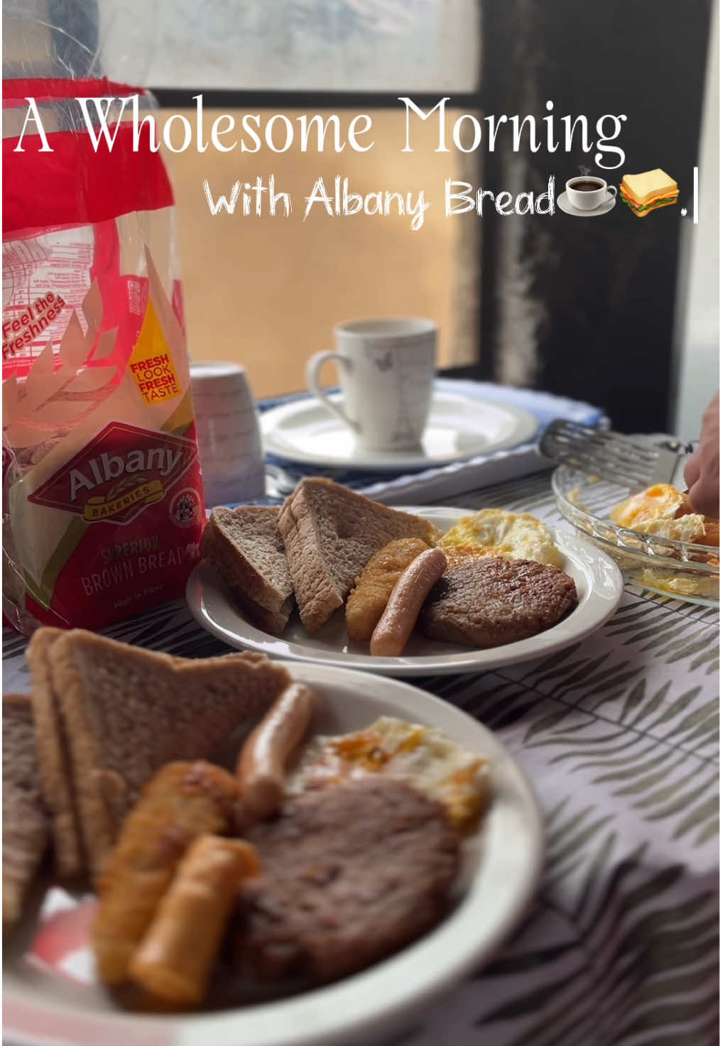 TikTok post by @neliswa_kamajola for Brand Advisor. Caption reads: @lovealbanybread Bringing families together, one....