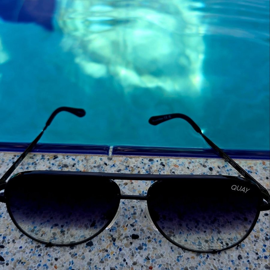 Instagram post by @hello.selda for QUAY. Caption reads: [...] with the right sunnies. 🏖️✨ My....