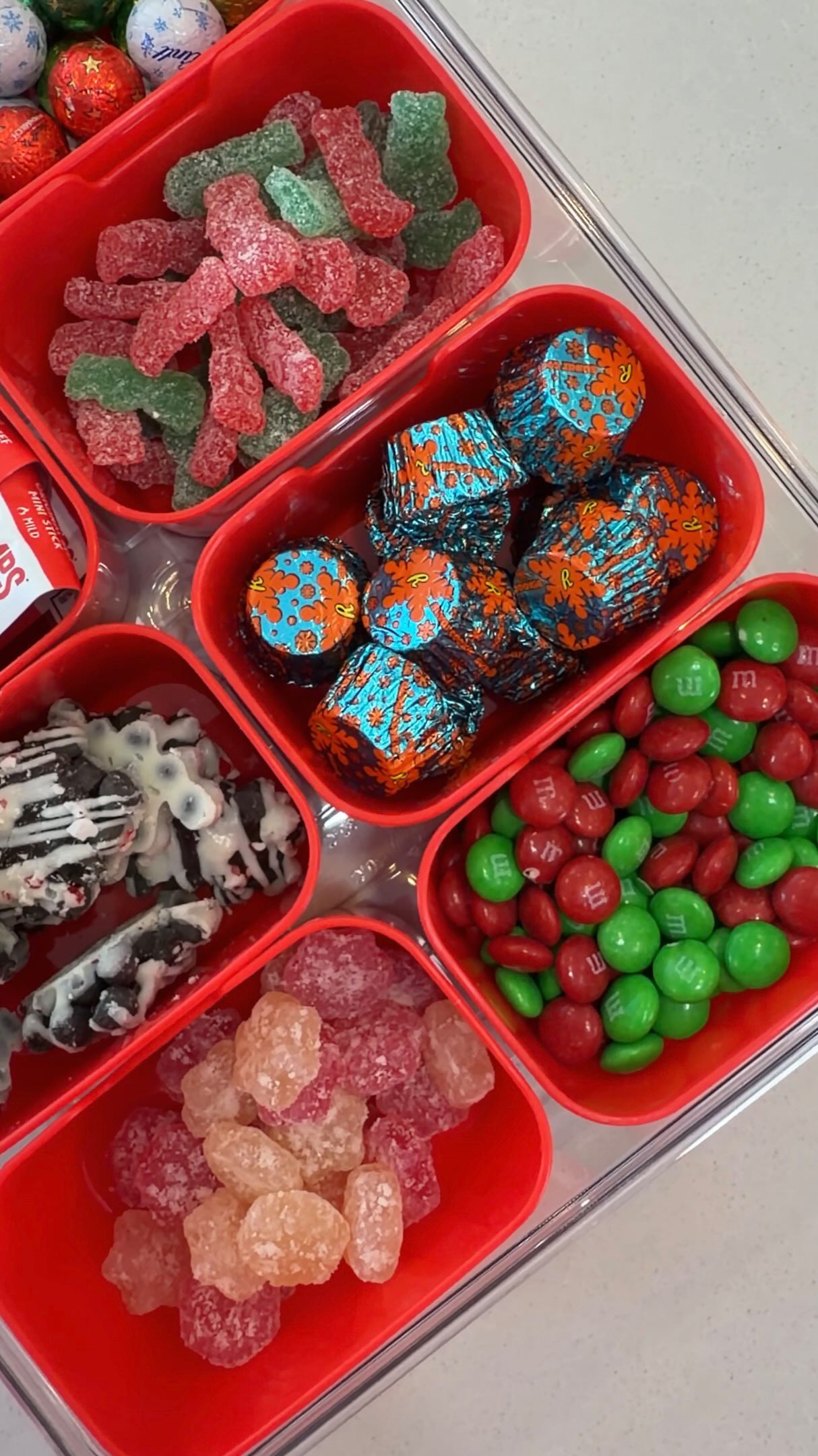 Instagram post by @caitliniola for Chomps. Caption reads: Holiday snack box restock....