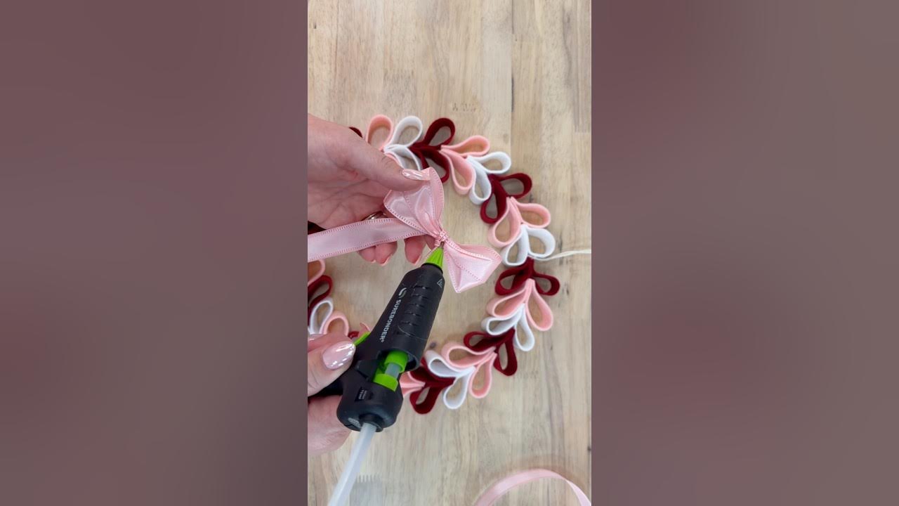 YouTube post by @JuliesWreathBoutique for Hobby Lobby. Caption reads: [...] Valentine section and party decor at Hobby....