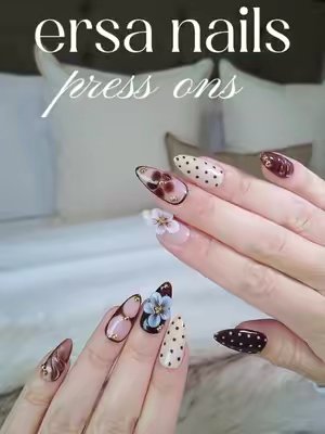 TikTok post by @lahhurah for Ersa Nails. Caption reads: fall nails are here 🧸🍂👜🤎 @Ersa Nails....
