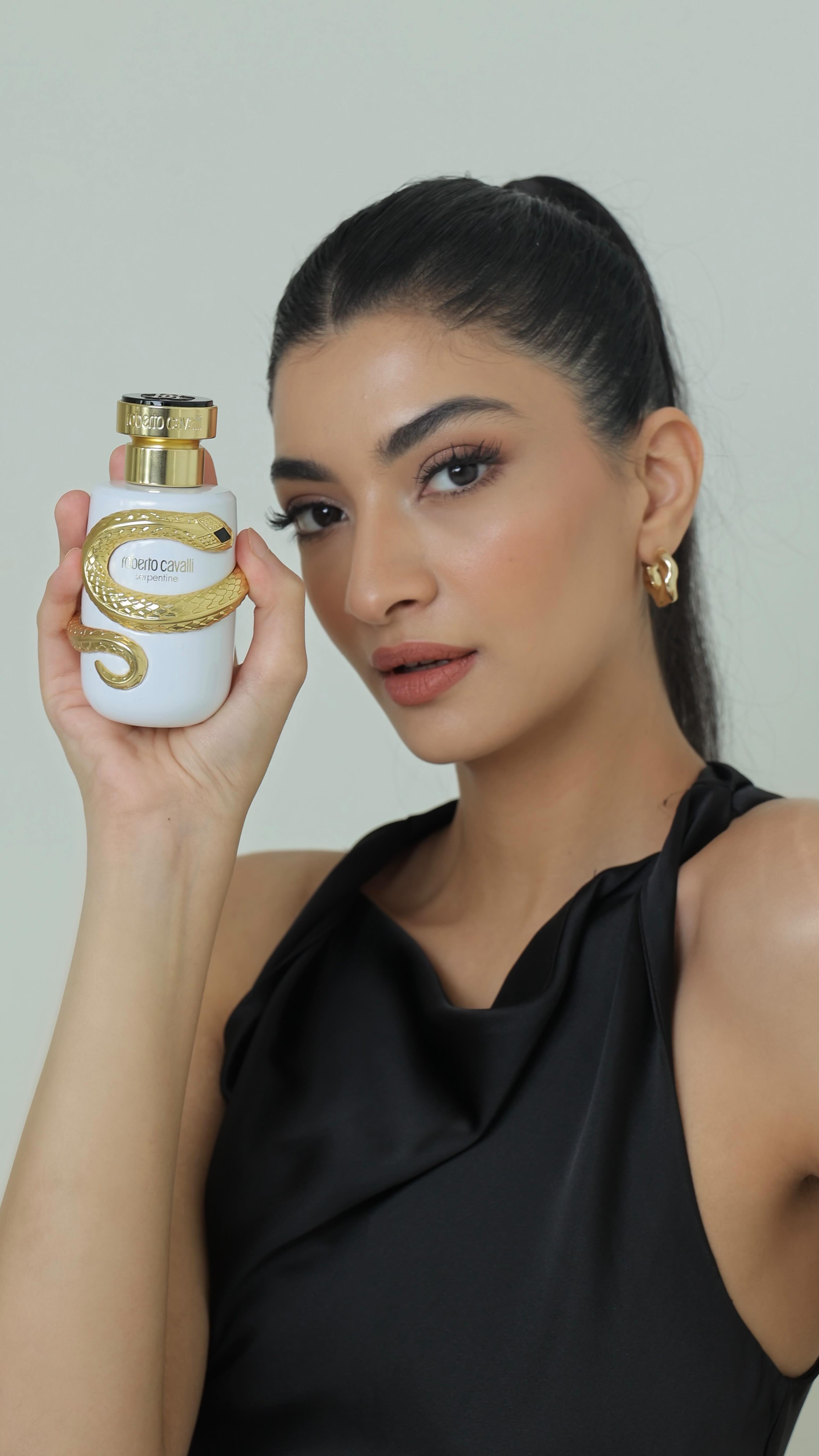 Instagram post by @hannaskhan for Roberto Cavalli. Caption reads: Is it a perfume or is it a bracelet?! 👀
The....