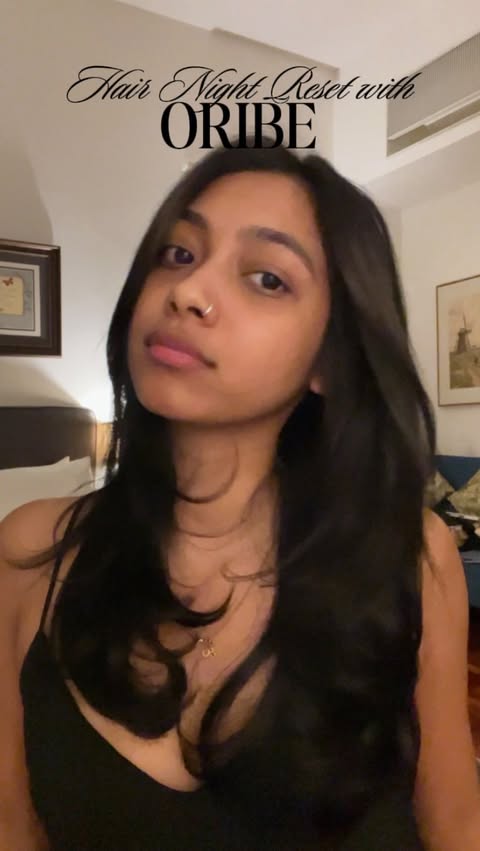 Instagram post by @nntaasya for Oribe. Caption reads: My little night reset with Oribe ✨
I swear my hair....