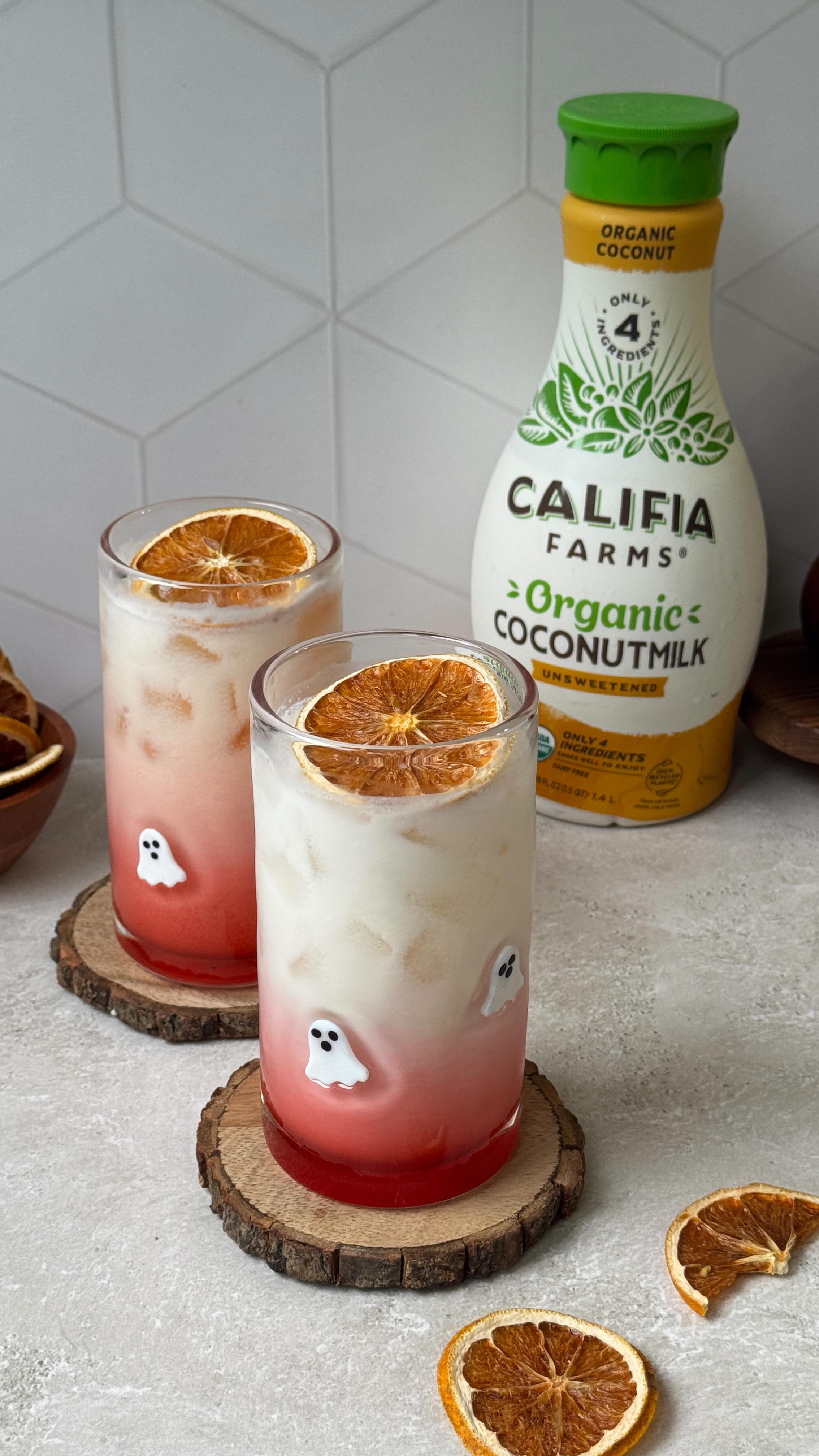 Instagram post by @milkteamali for Califia Farms. Caption reads: make these hauntingly pretty mocktails for spooky....