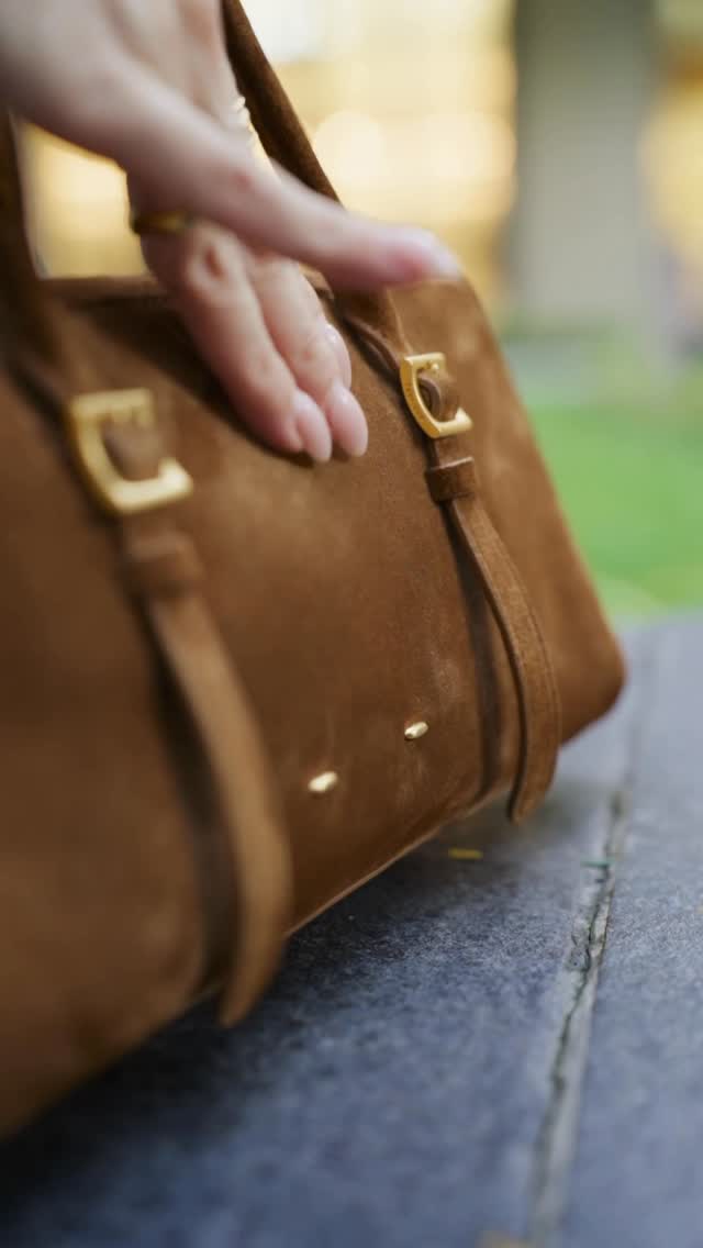 Instagram post by @thehandbagtales.ph for Fabrique. Caption reads: Suede season starts now 🧸
Comment Fabrique and....