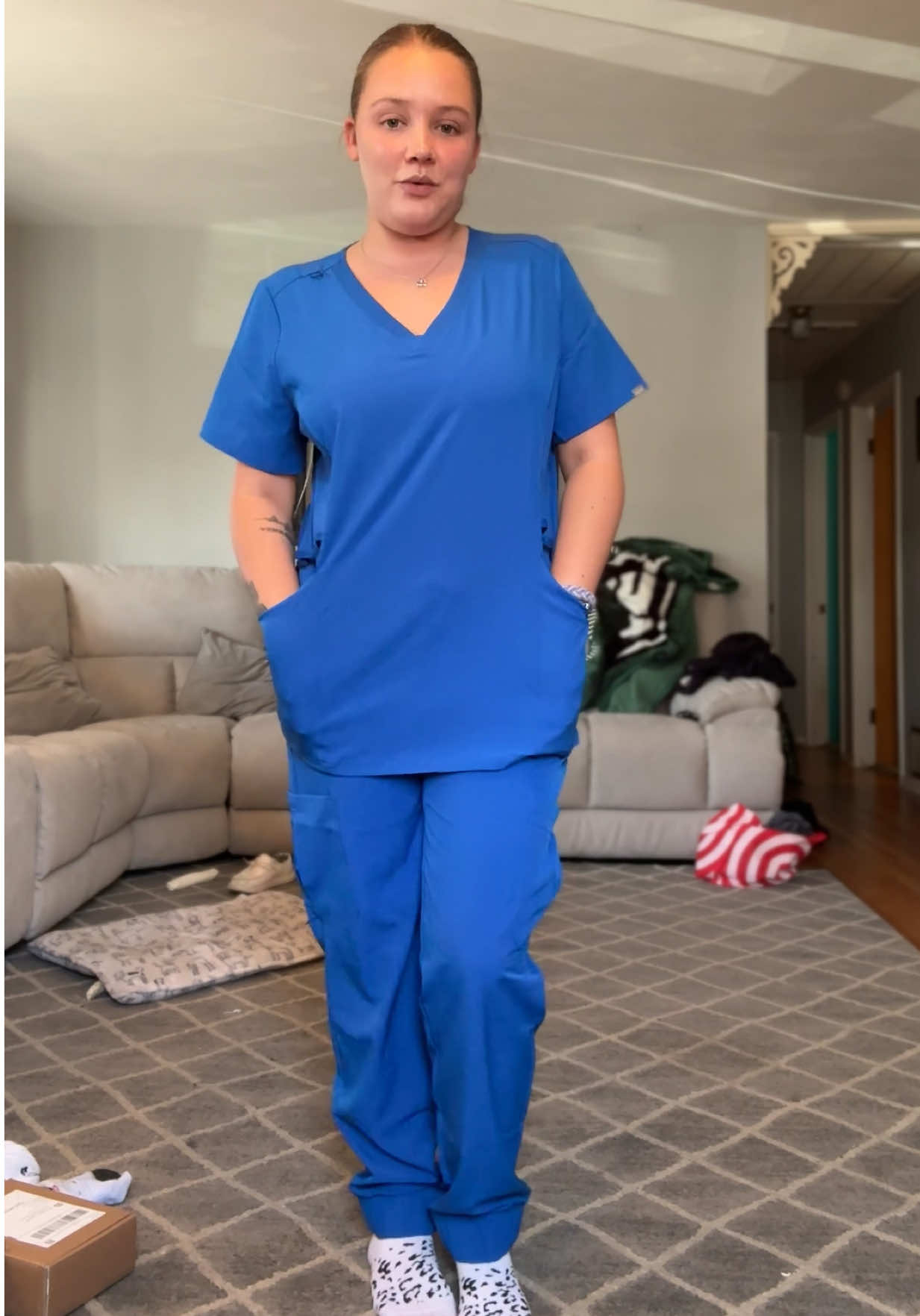 TikTok post by @emma.ry for Hanes. Caption reads: the most affordable scrubs👏🏻🤩 @Hanes #hanes....