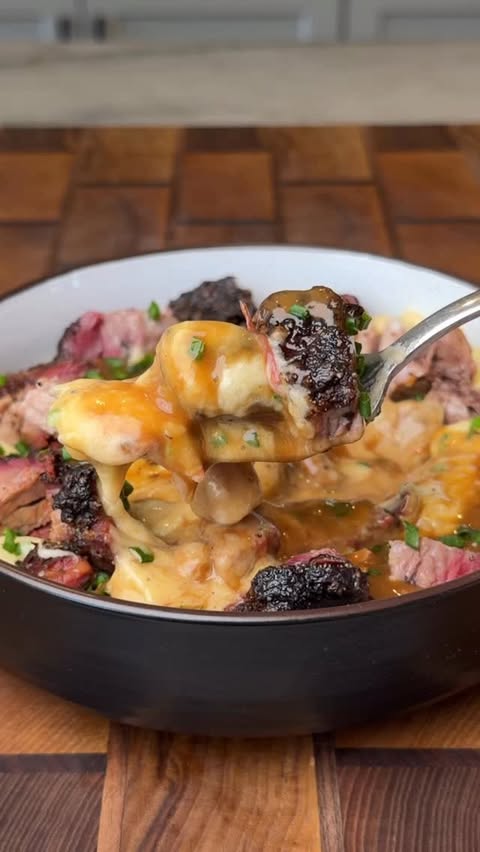 Instagram post by @burnt_pellet_bbq for Kingsford. Caption reads: Brisket with Mashed Potatoes & Gravy

This is the....