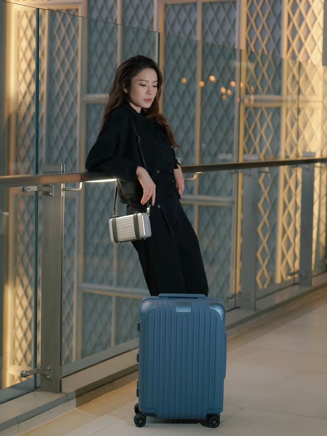 Instagram post by @aff_taksaorn for RIMOWA. Caption reads: A shade of blue 💙 @RIMOWA #RIMOWA #RIMOWADistinct....