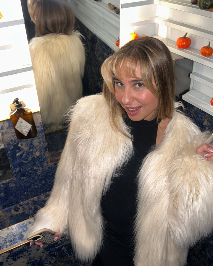 Instagram post by @louisergt for The Kooples. Caption reads: Night in Milan 🤍

@thekooples fur (produit....