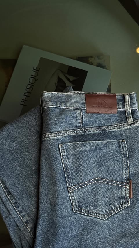 Instagram post by @joshbram_ for Armani Exchange. Caption reads: [...] your in-laws this christmas....