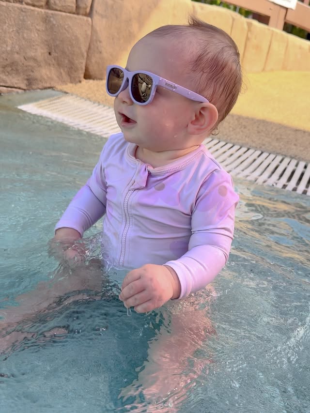 Instagram post by @haus.of.holmes for Polarised Baby Sunglasses. Caption reads: Soaking up the last of the warmer weather this....