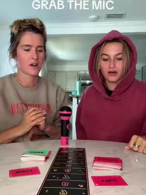 TikTok post by @calleyandmeg for Lucky Egg. Caption reads: GRAB THE MIC with @Lucky Egg @MegDav and @Calley....