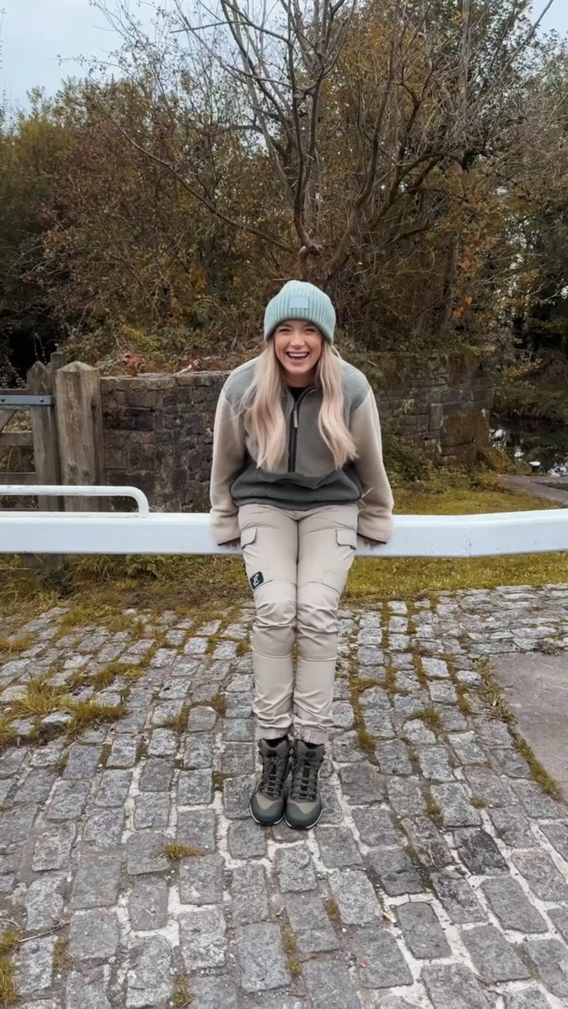 Instagram post by @sarah_walking_ for RevolutionRace. Caption reads: AD|  Cold evenings? Sorted. 🍂 My GP trousers keep....