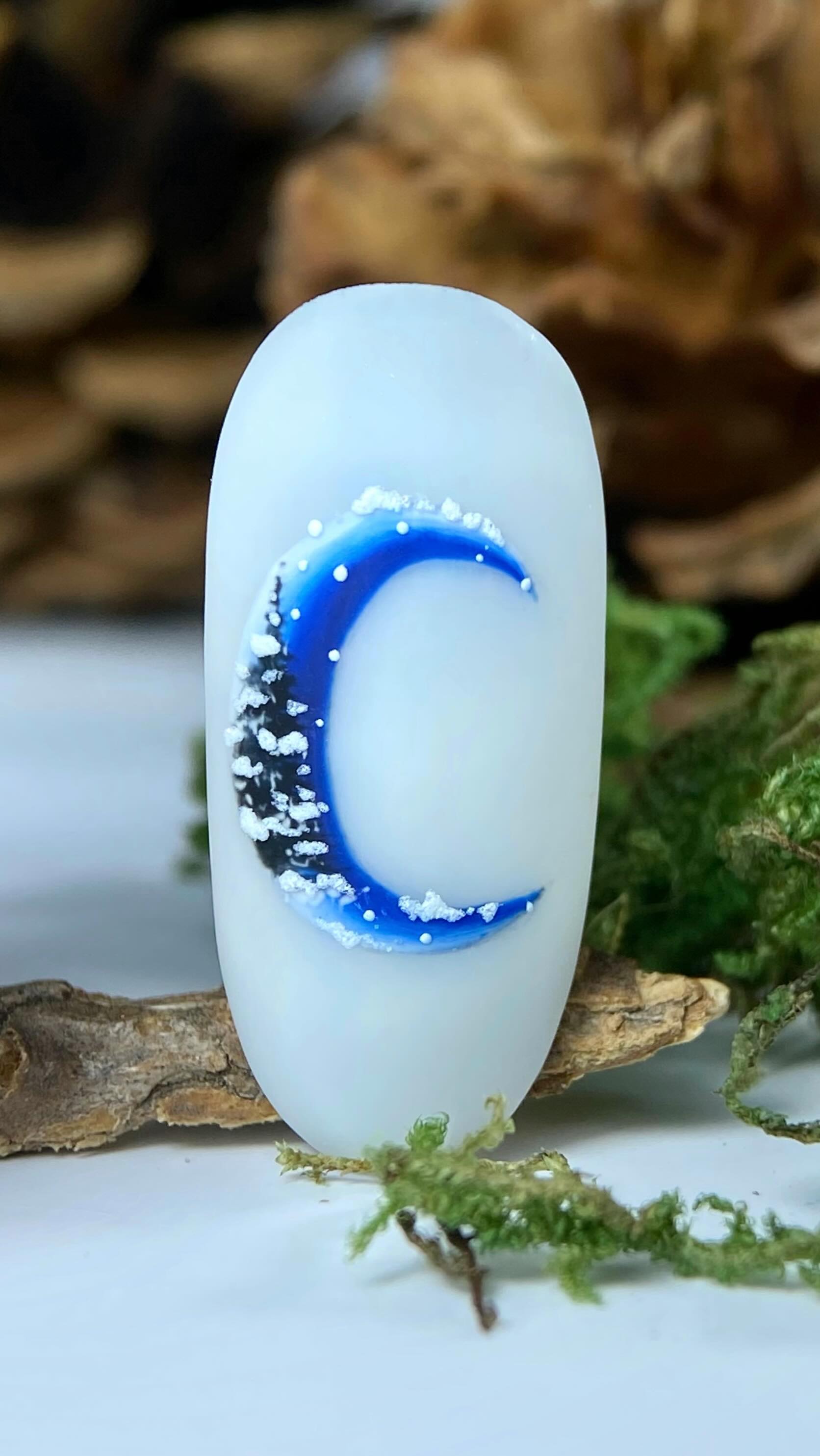 Instagram post by @catherina_kety for Madam Glam. Caption reads: Winter Moon 🌙💙
@madam_glam 
Color 
❄️ Riverwalk....