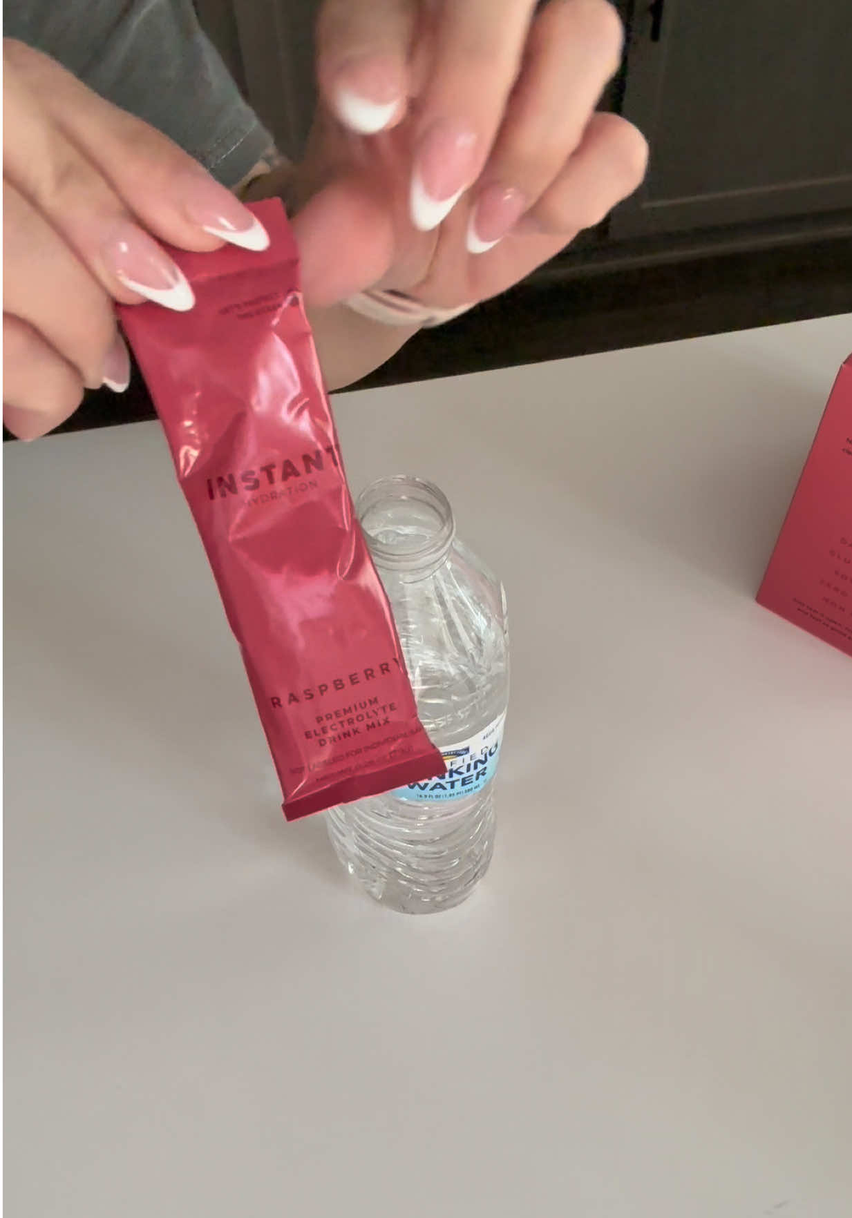 TikTok post by @nicolettelifts for Instant Hydration. Caption reads: [...] he grabs is electrolytes - aka @Instant....