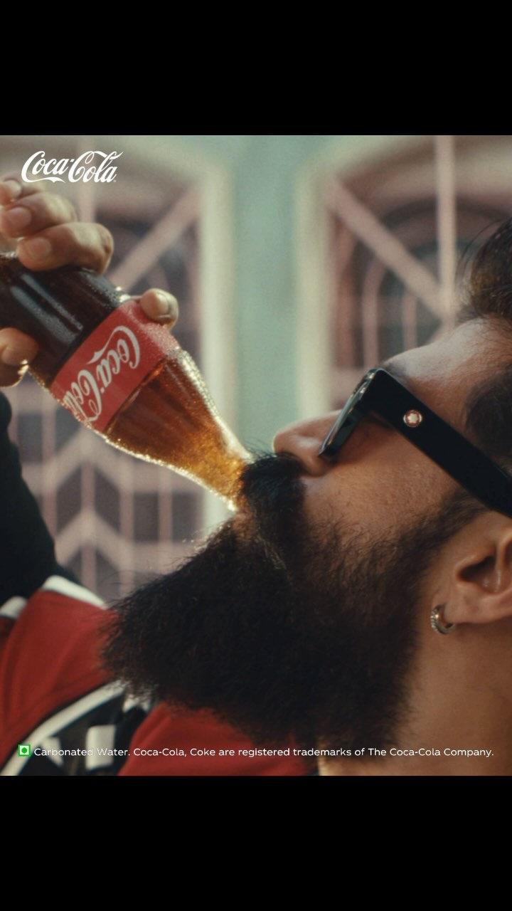 Instagram post by @thenameisyash for Coca-Cola India. Caption reads: When I say Halftime for everyone, it means Coke....