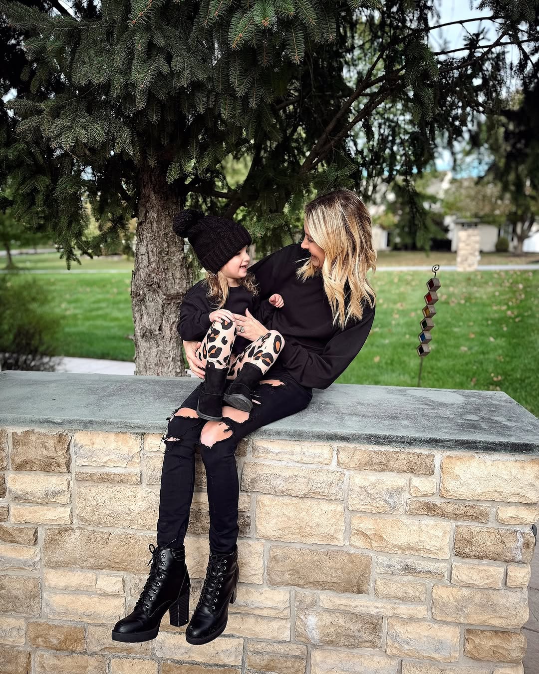Instagram post by @trendyambitiousblonde_ for FabKids. Caption reads: Cozy Fall Vibes with my sweet girl. Can we just....