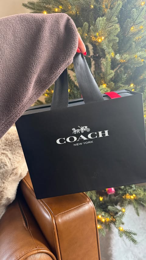 Instagram post by @ellie_teale for Coach. Caption reads: Christmas present to myself unboxing for Vlogmas....