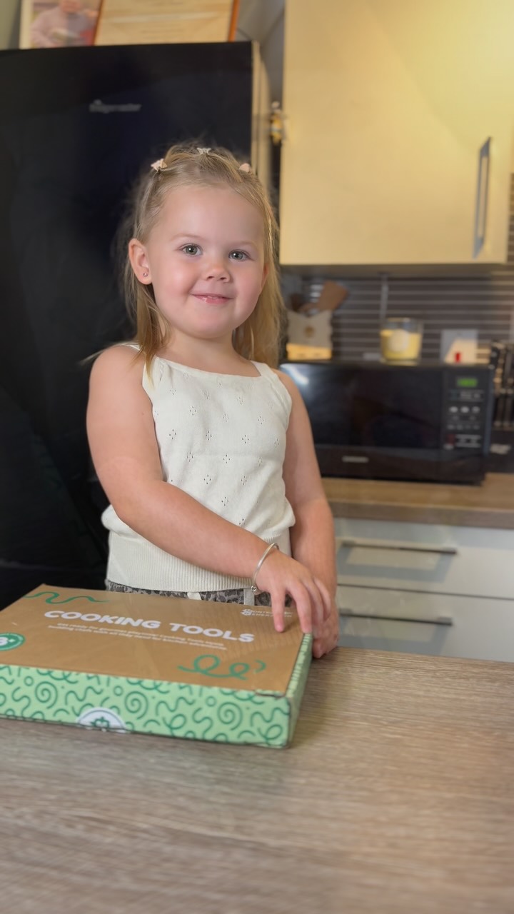 Instagram post by @aria_g_wardrobe for Montessori Generation. Caption reads: [...] in action 🍴✨ Aria is loving her Montessori....