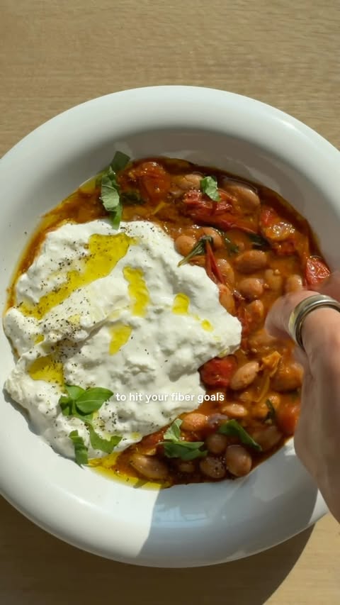 Instagram post by @clairesharrynroberto for Seed. Caption reads: 10 CLOVE GARLIC + TOMATO BORLOTTI BEANS A warming,....