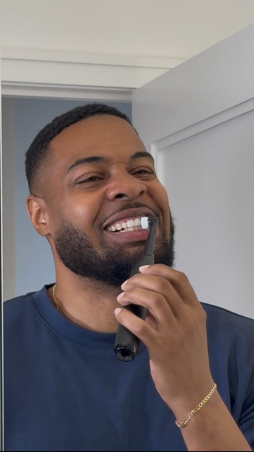 Instagram post by @therobertburton for Oral-B. Caption reads: #OralBPartner #Ad Brushing just got its own....