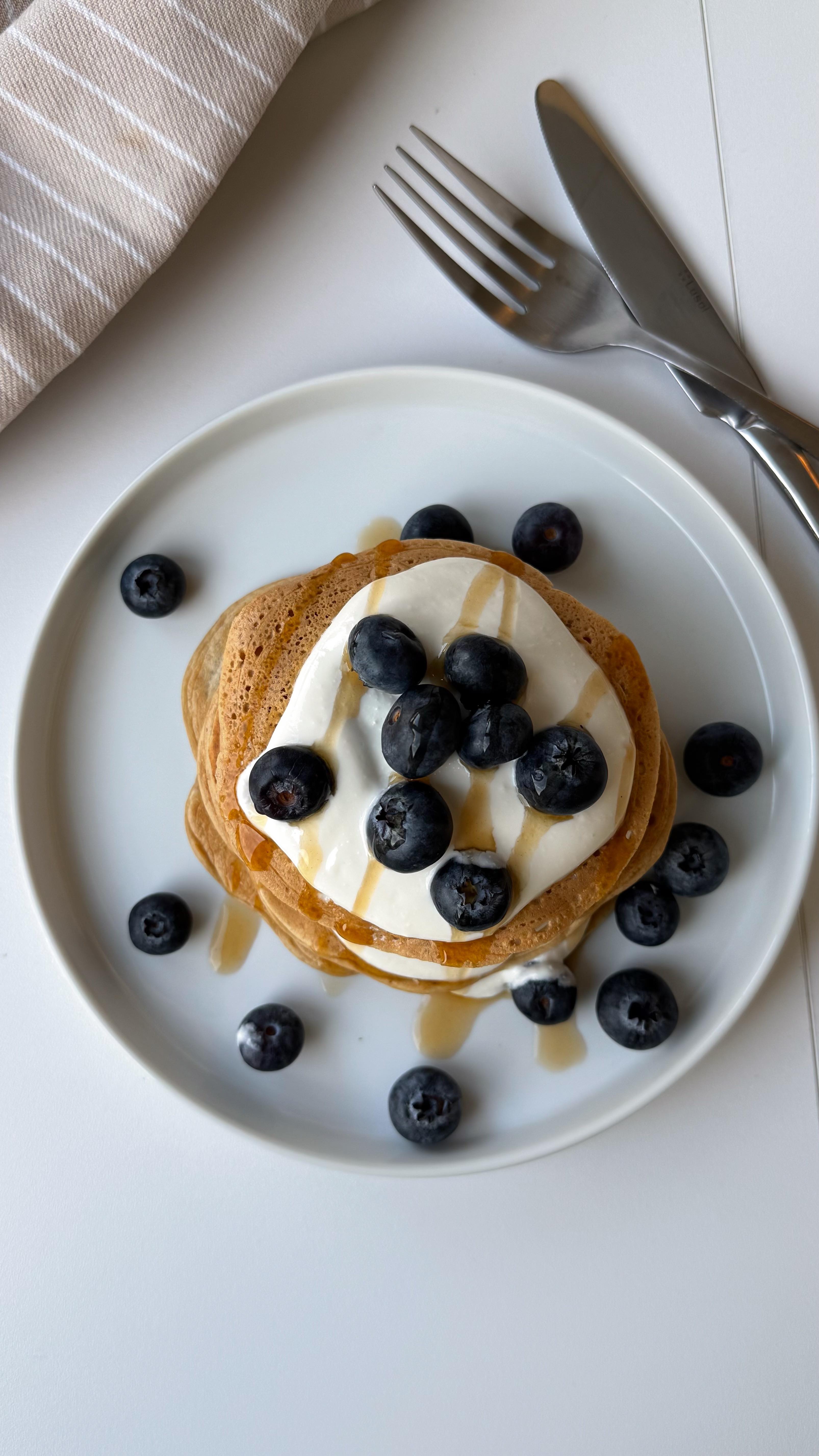 Instagram post by @patiispage for foodspring. Caption reads: The BEST high protein pancakes I’ve tried so far!!....