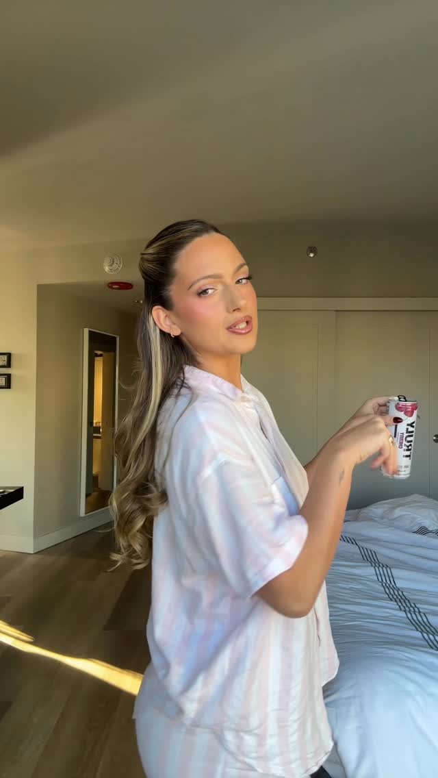 Instagram post by @mariaciuffo for Truly Hard Seltzer. Caption reads: Should I just wear this robe everyday? @truly.