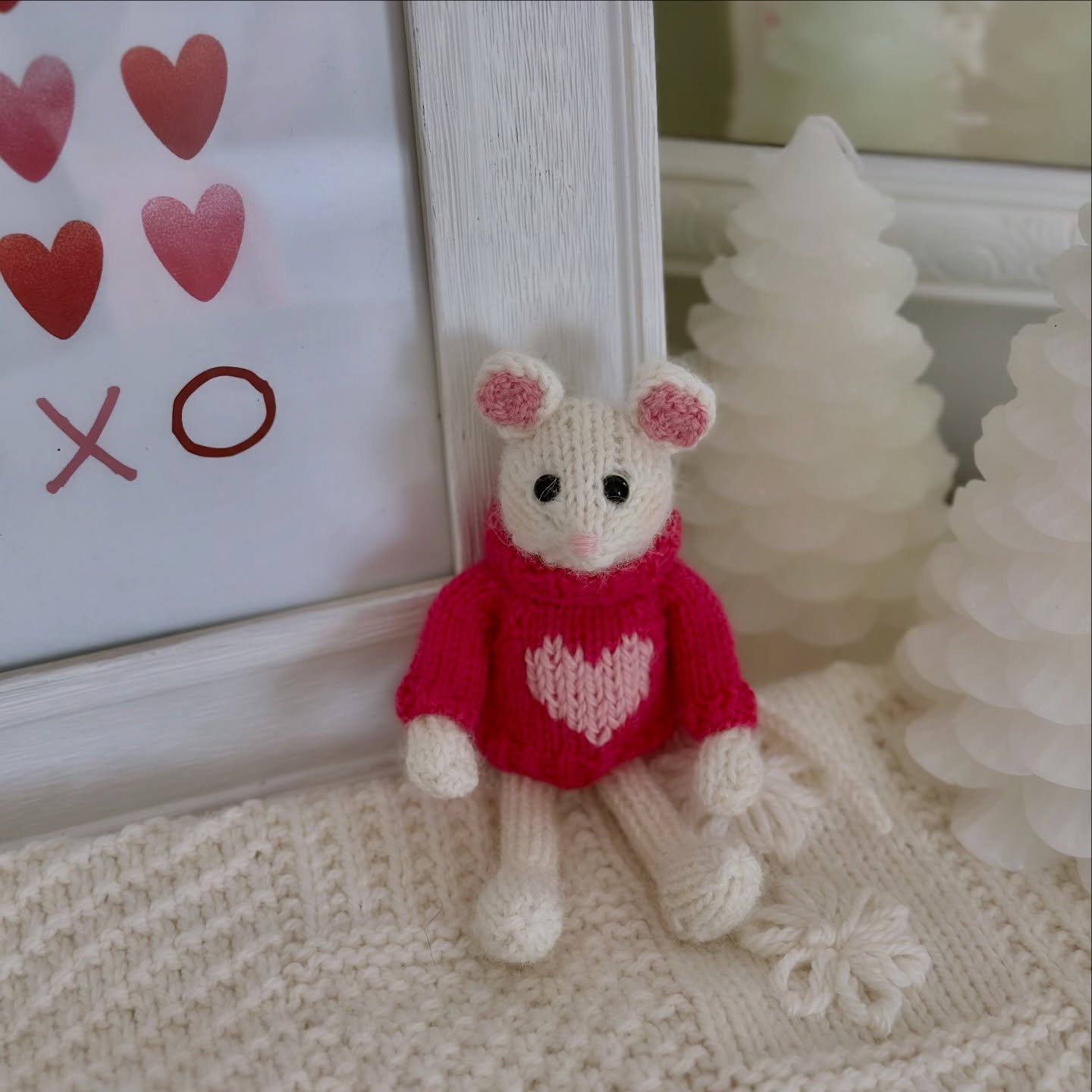 Instagram post by @warmwoolenwishes for Knit Picks. Caption reads: New year, new mouse 🩷🐭💌 Made from @knit_picks....