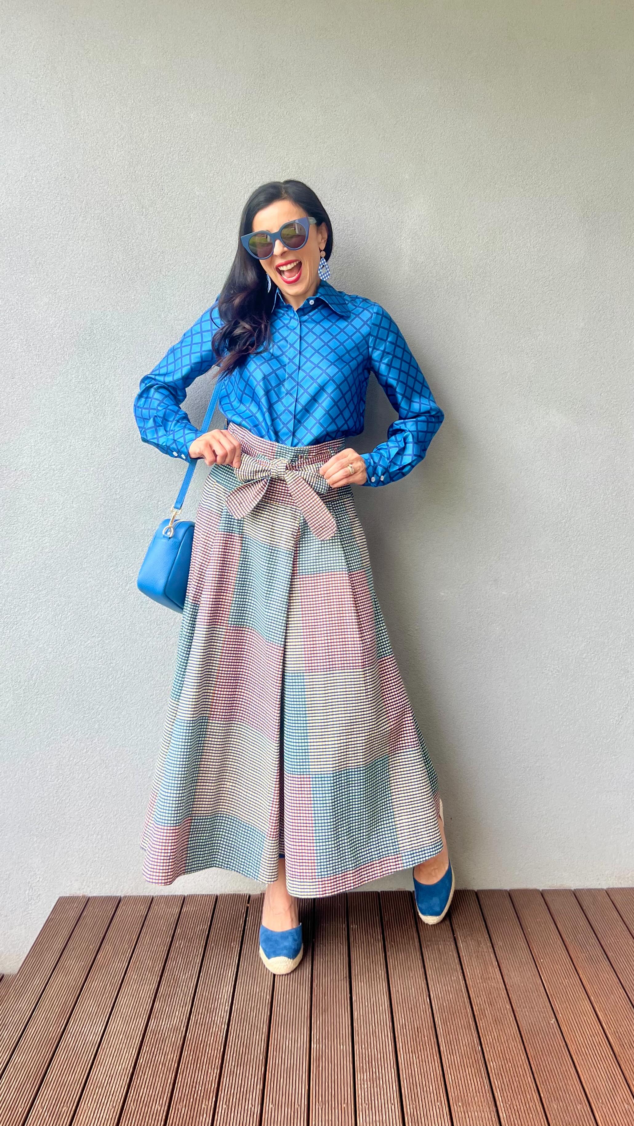 Instagram post by @dreams.of.colour for Pom Pom London. Caption reads: Mixing it up with checks on checks! 💙💚🧡🩵

My....