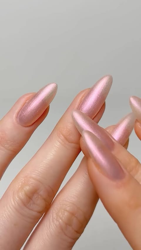 Instagram post by @thehotblend for essie. Caption reads: Ad. Pink sparkly nails for spring🩷 @essie....