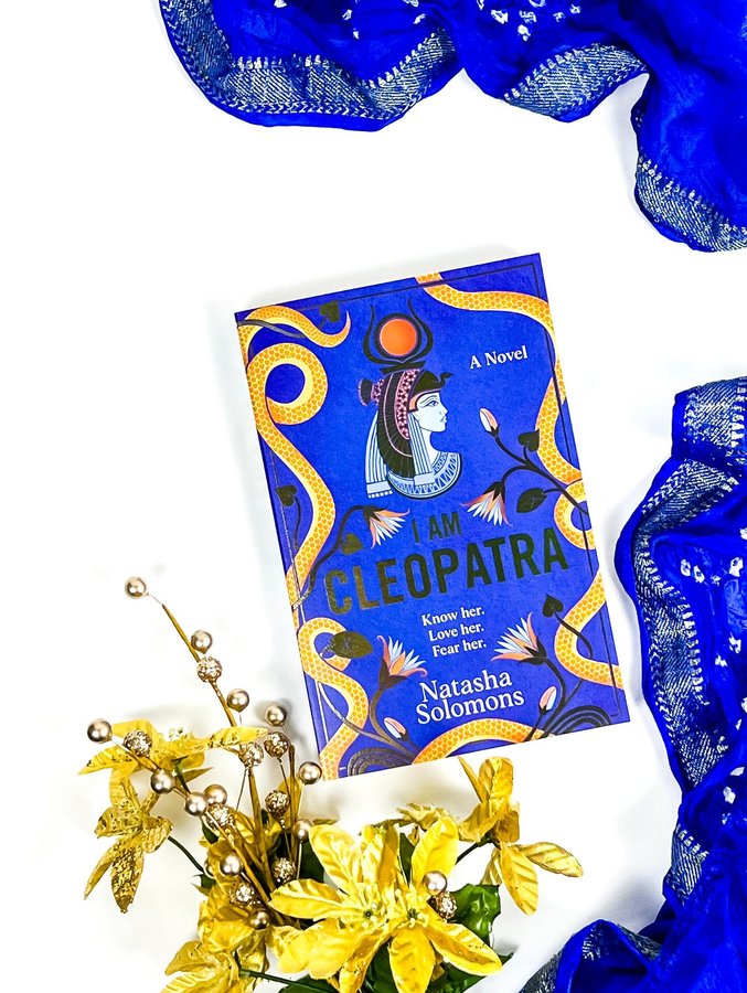 Instagram post by @subakka.bookstuff for TLC Book Tours. Caption reads: •ＢＯＯＫ ＴＯＵＲ•⁣
⁣
𝐈 𝐀𝐦 𝐂𝐥𝐞𝐨𝐩𝐚𝐭𝐫𝐚⁣
𝐁𝐲....