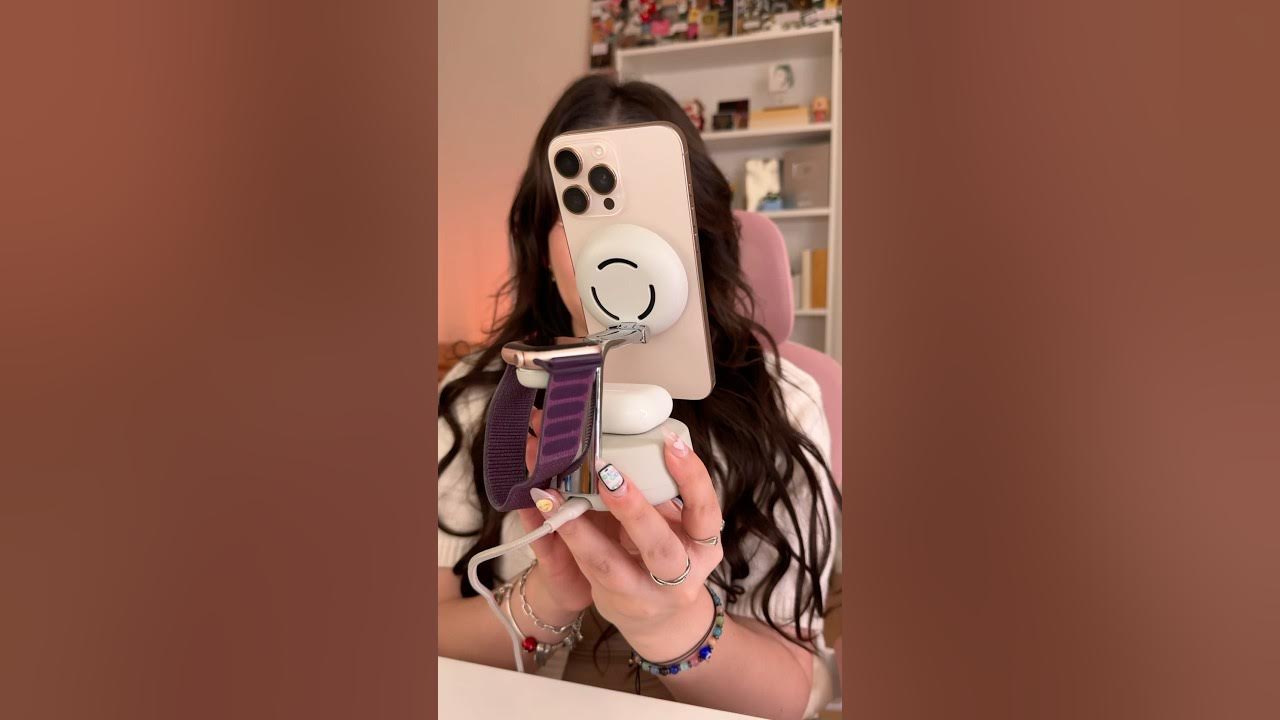 YouTube post by @MaybeHeilly for Belkin. Caption reads: MY IPHONE’S NEW HOME✨📱 (aka my Belkin dock✨)....