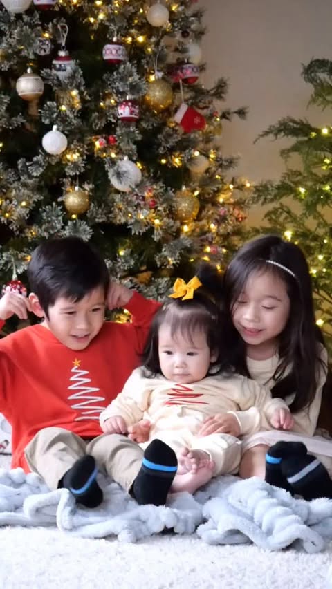 Instagram post by @bossbabykiki for MiniOlie. Caption reads: Holiday Magic 🎄✨

Kids wearing matching family....