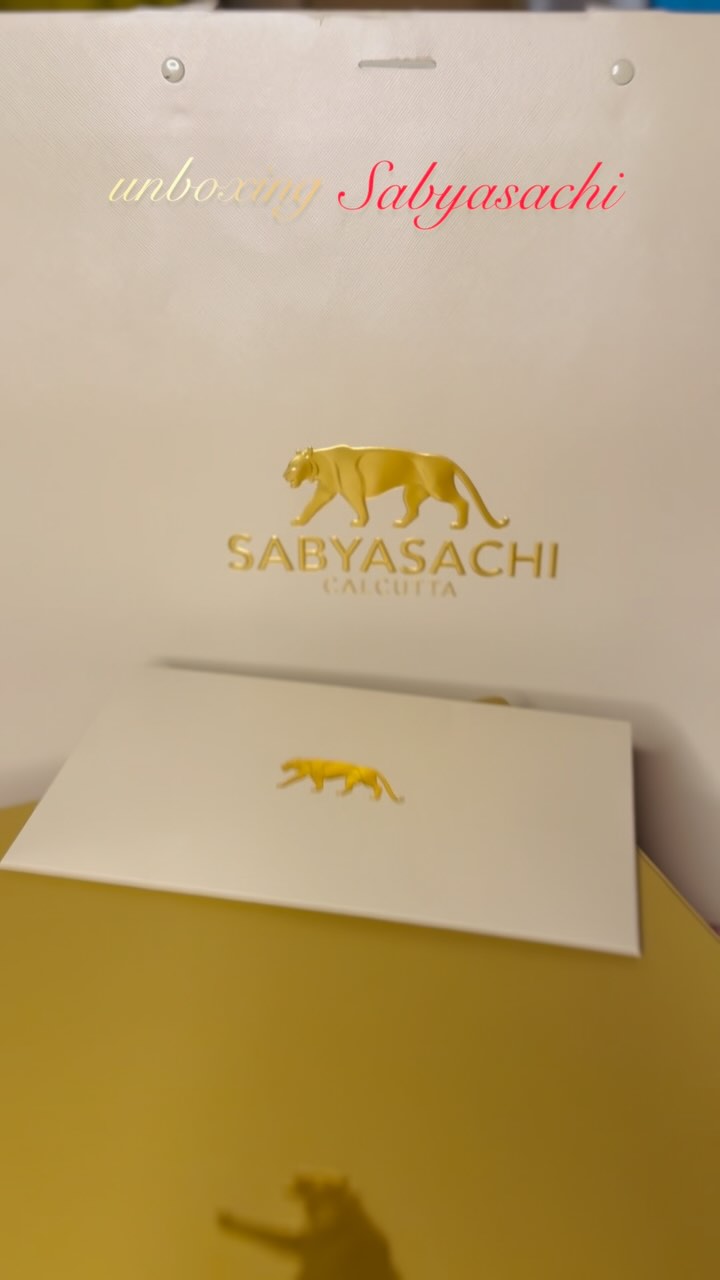 Instagram post by @onuthepreetiest for Sabyasachi. Caption reads: unboxing my Dream Wedding Saree....