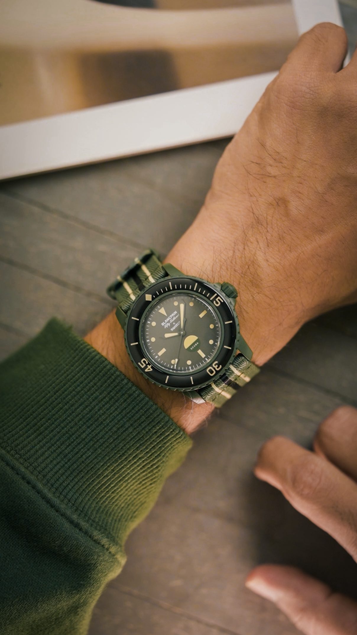 Instagram post by @whatknotman for Swatch. Caption reads: Five MoonSwatches deep and this Swatch x Blancpain....