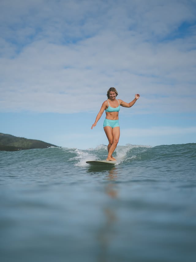 Instagram post by @surfgirlnz for JOLYN. Caption reads: warm days & little waves wearing @jolynclothing....