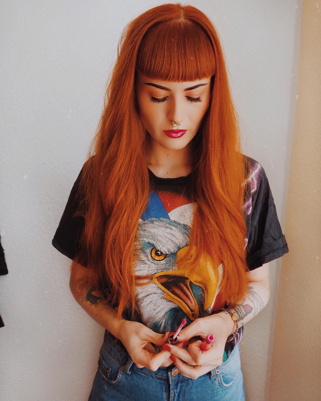 Instagram post by @viorosie for Manhattan. Caption reads: lipstick can’t solve problems, but it’s a pretty....