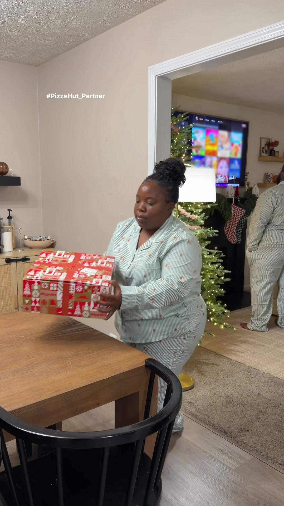 TikTok post by @janiceyalittle for Pizza Hut. Caption reads: #ad #PizzaHut_Partner Cozy holiday movie night +....