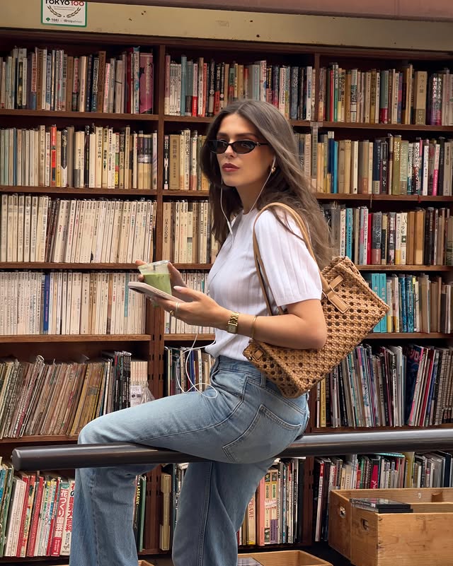 Instagram post by @heloise.guillet for Michael Kors. Caption reads: Took my new @michaelkors bag for a walk Publicité.
