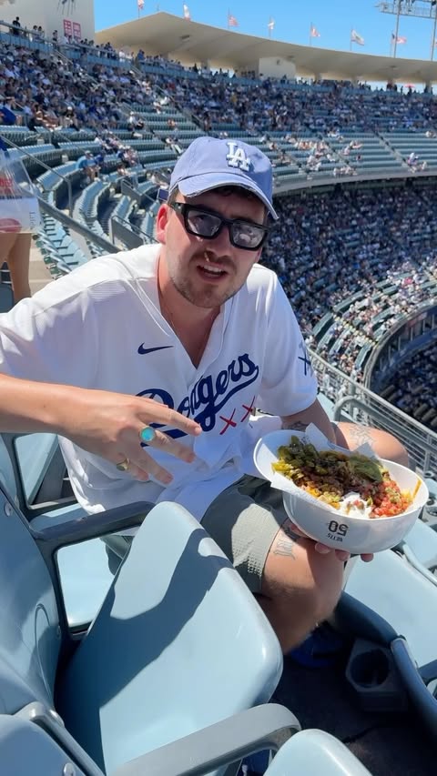 Instagram post by @whatwillycook for Major League Baseball. Caption reads: It’s a hat full of nachos at The @dodgers stadium....
