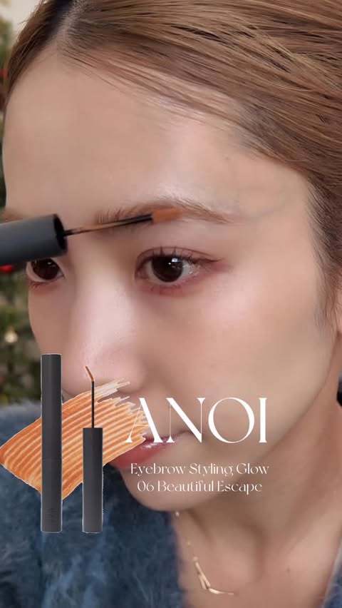 Instagram post by @miyu_mochizuki for ANOI (アノイ). Caption reads: @anoi.official の新色🍊🧡 眉にオレンジが入ると抜け感でて可愛いー！ [...].