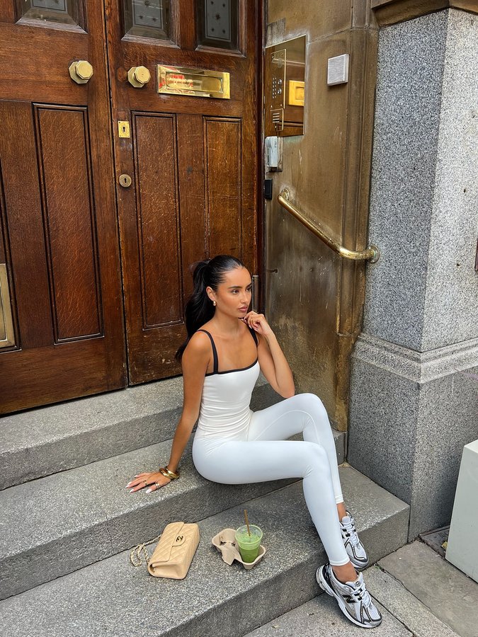 Instagram post by @elliecasei for Astoria Activewear. Caption reads: morning strolls 🤍🍶 @astoria_activewear ad.