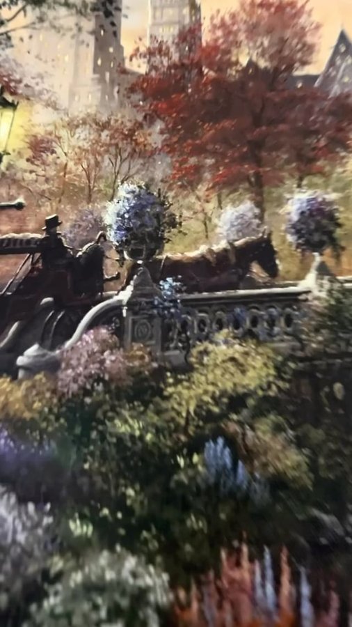 Instagram post by @ilanafofana for Thomas Kinkade Studios. Caption reads: 🍁 Fall in Central Park, at its finest. 🍂....