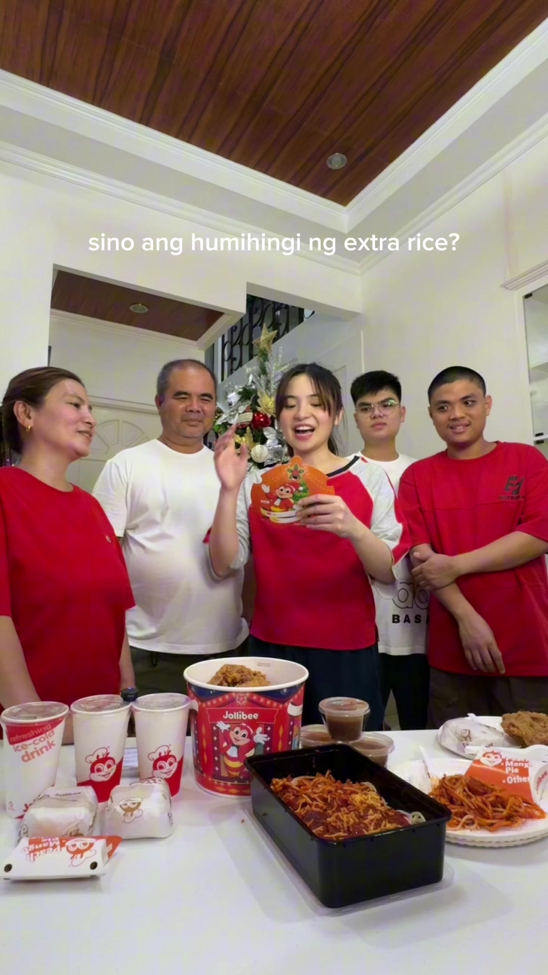 TikTok post by @sharlene.sanpedro for Jollibee. Caption reads: [...] it with family and syempre good food!....