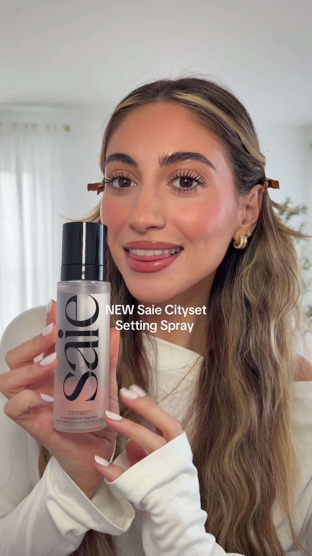 TikTok post by @samanthaa.nicole for Saie hello. Caption reads: trying & weartest @Saie NEW setting spray!! I was....