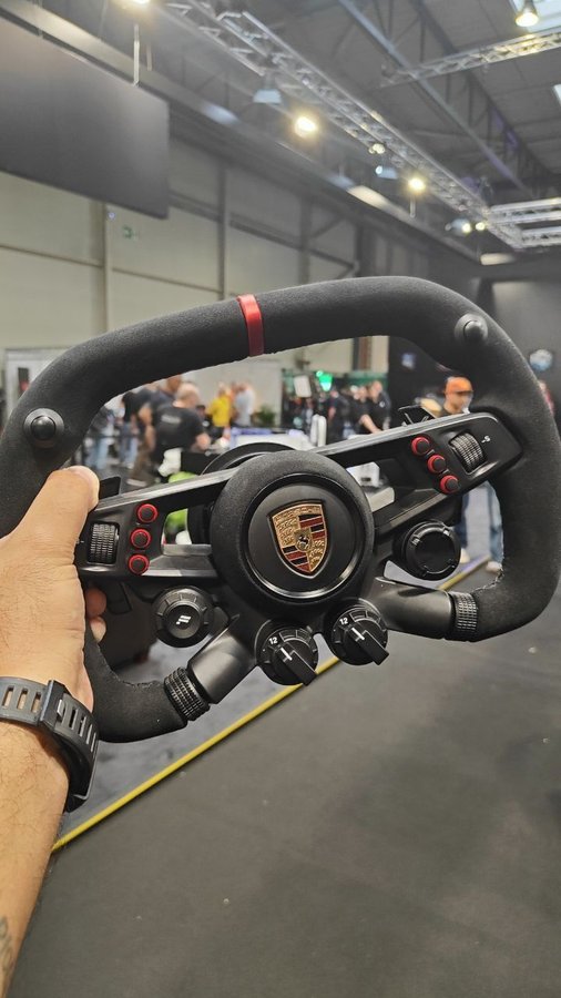 Instagram post by @theradweasel for Fanatec. Caption reads: Wheels for days at the @fanatec_official boot....